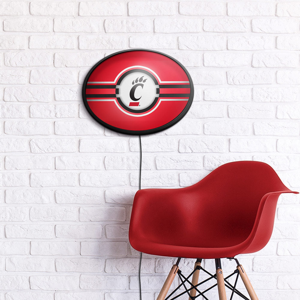 Cincinnati Bearcats Slimline Oval Lighted Wall Sign Room View