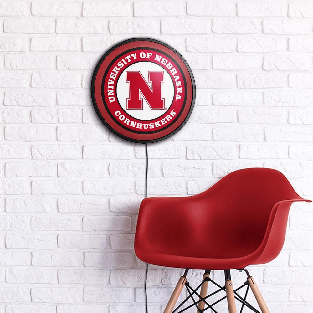 Nebraska Cornhuskers Slimline Round Lighted Wall Sign Room View
