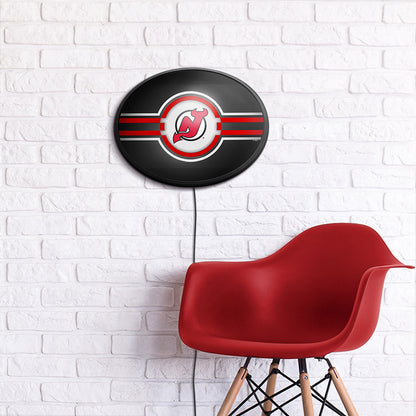 New Jersey Devils Slimline Oval Lighted Wall Sign Room View