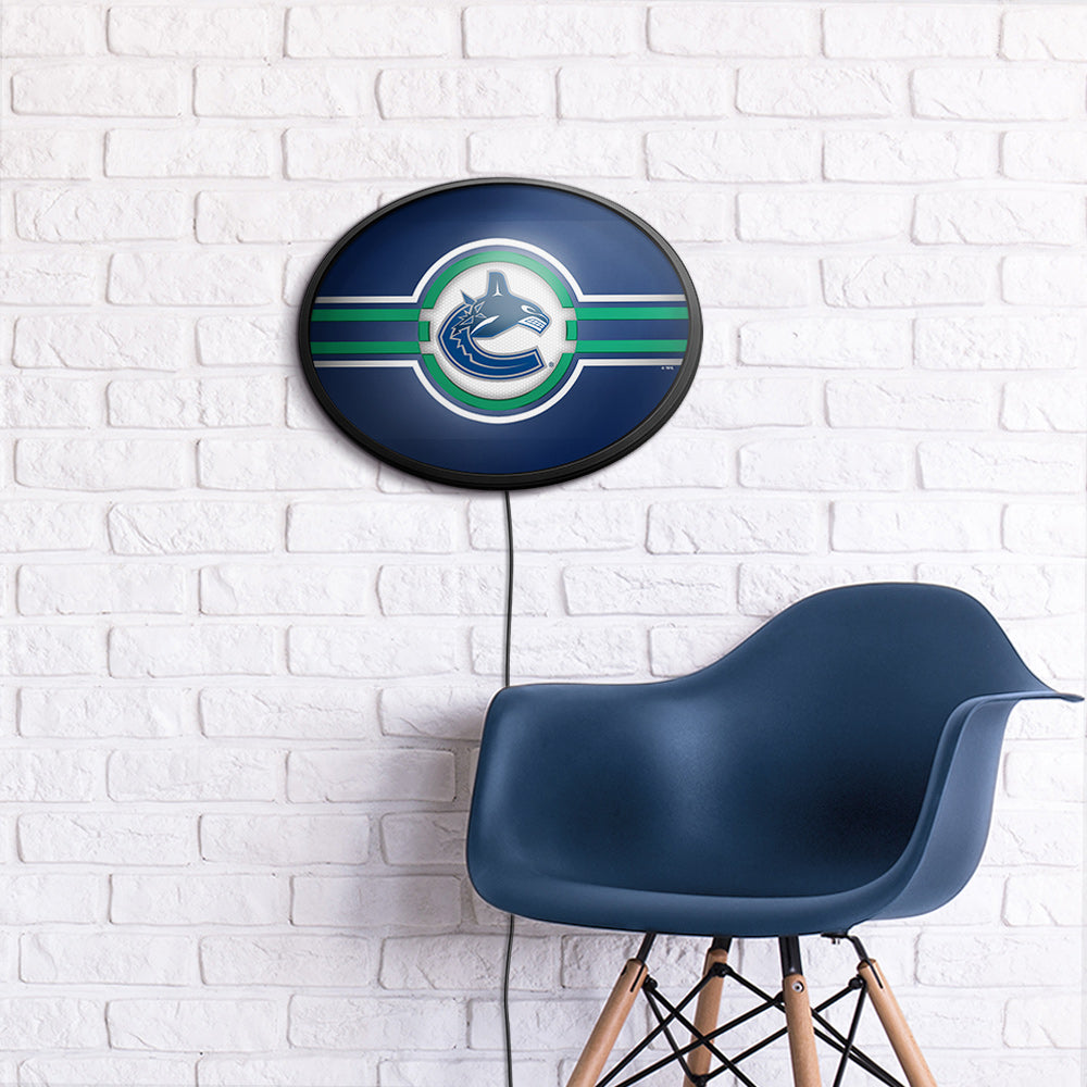 Vancouver Canucks Slimline Oval Lighted Wall Sign Room View