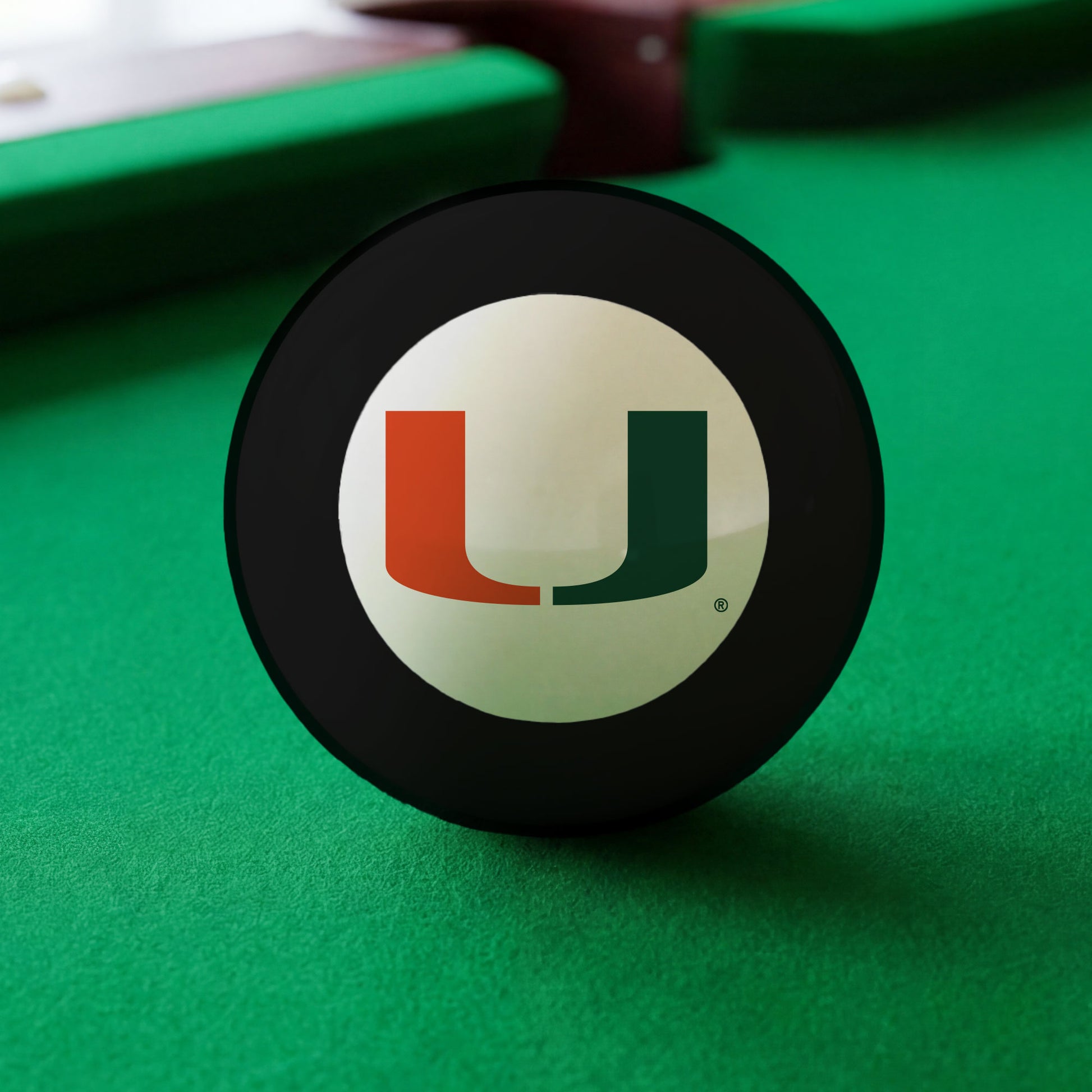 Official Miami-Hurricanes-Pool-8-Ball Collegiate 8-Ball Lined Up on Green Felt Pool Table Surface with Billiard Ball Rack