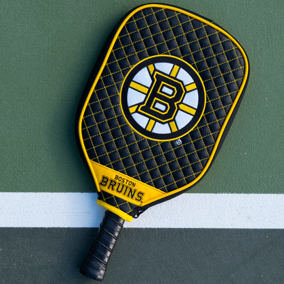Boston Bruins quilted pickleball paddle cover on court view