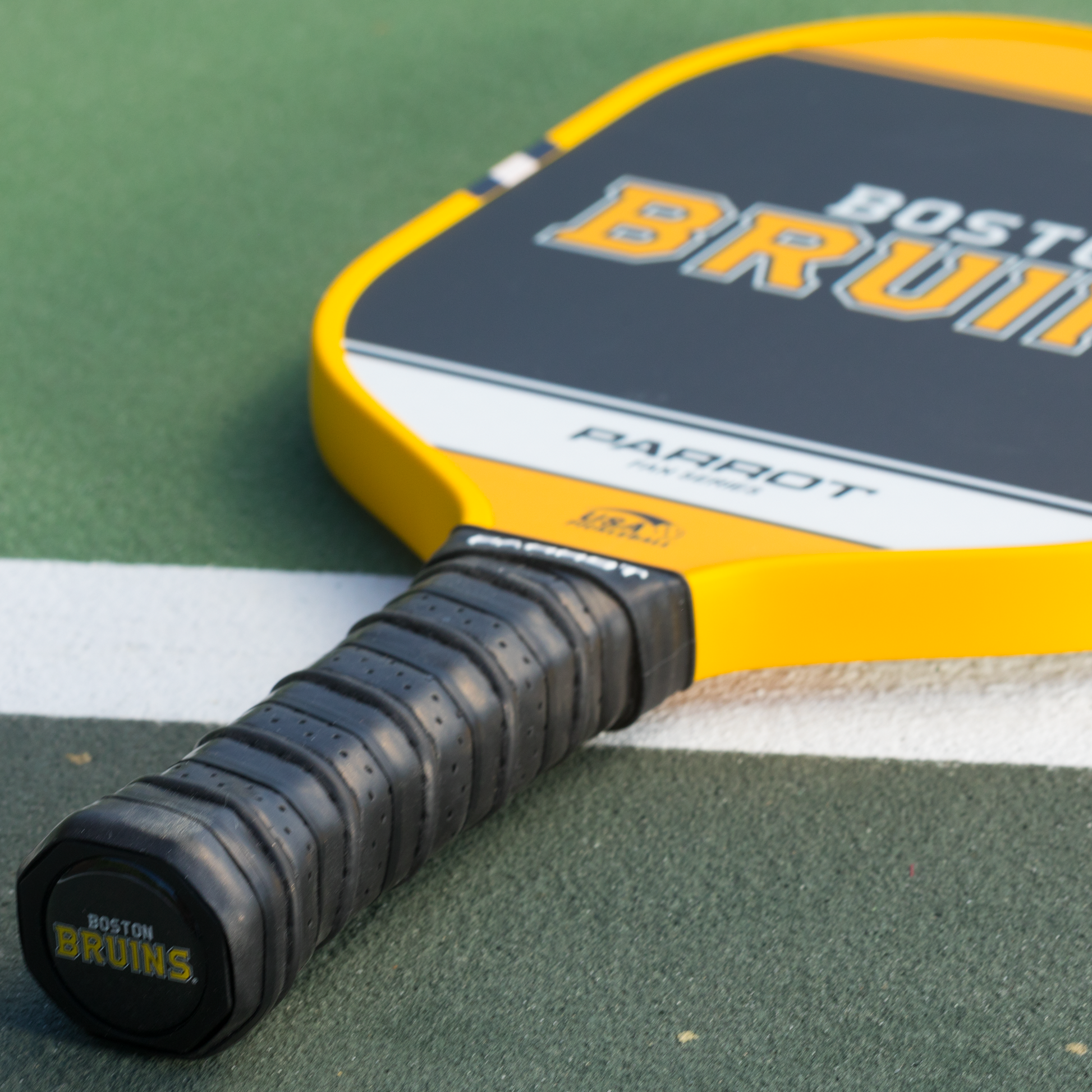 Boston Bruins Sport Plus pickleball paddle back view on the court