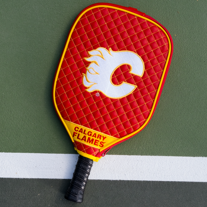 Calgary Flames quilted pickleball paddle cover on court view