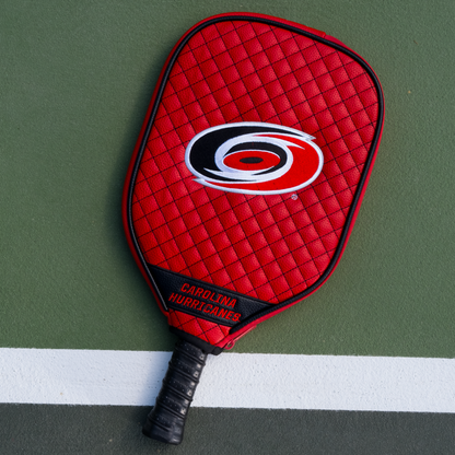 Carolina Hurricanes quilted pickleball paddle cover on court view