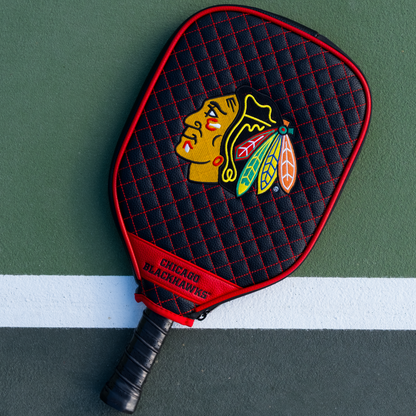 Chicago Blackhawks Black quilted pickleball paddle cover on court