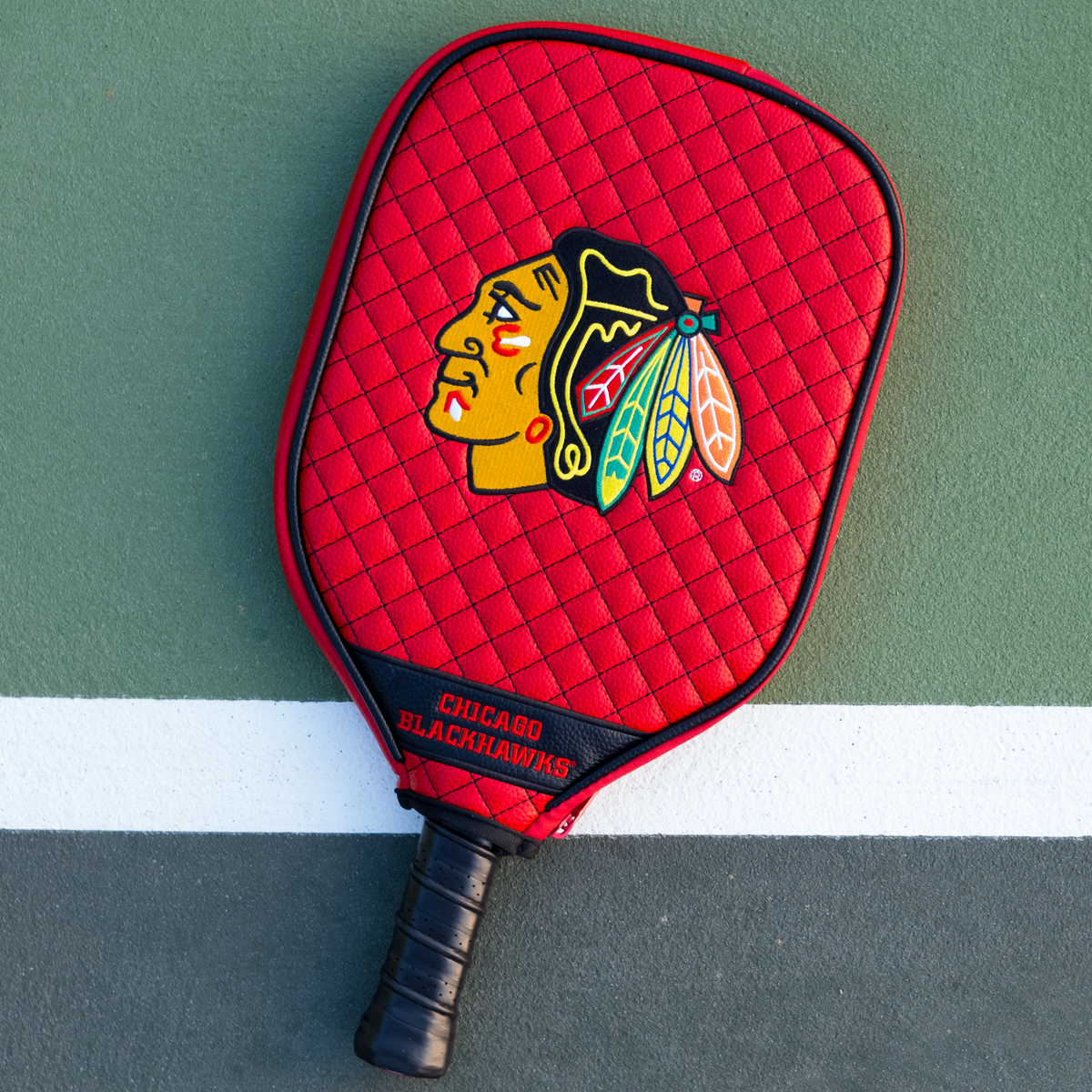 Chicago Blackhawks Red quilted pickleball paddle cover on court