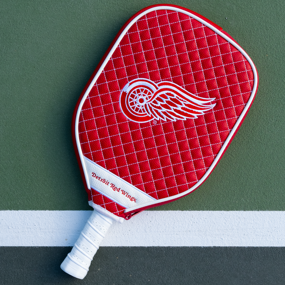 Detroit Red Wings Red quilted pickleball paddle cover on court