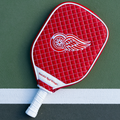 Detroit Red Wings Red quilted pickleball paddle cover on court