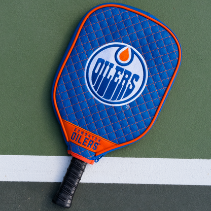 Edmonton Oilers quilted pickleball paddle cover on court view