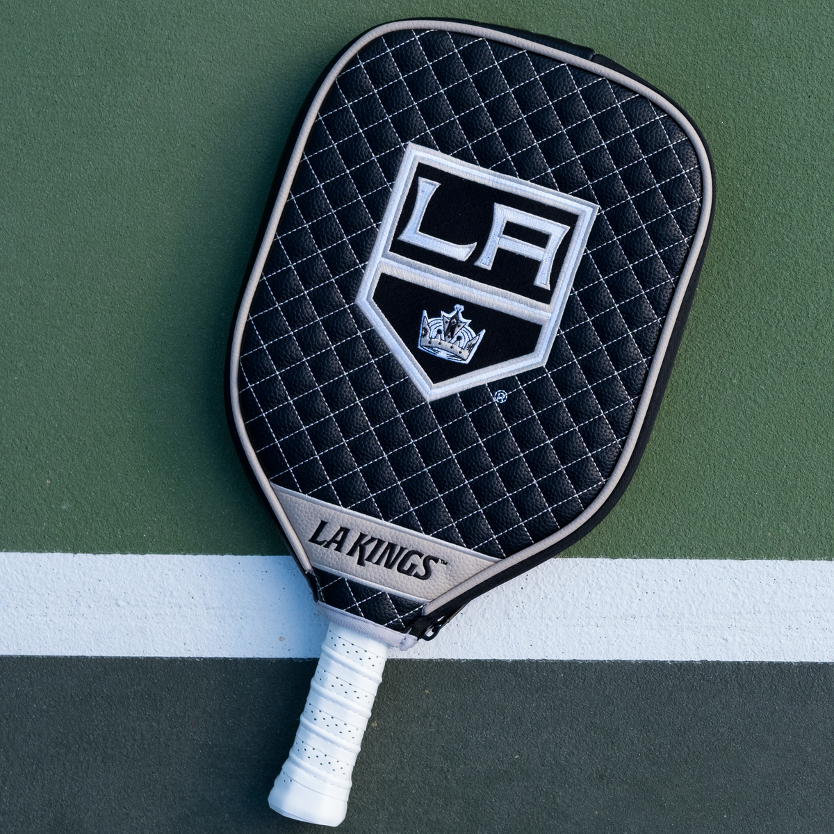 Los Angeles Kings quilted pickleball paddle cover on court view