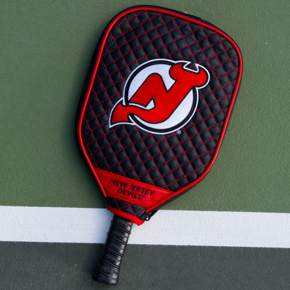 New Jersey Devils Black quilted pickleball paddle cover on court