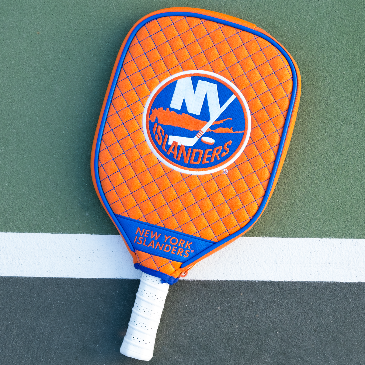 New York Islanders Orange quilted pickleball paddle cover on court
