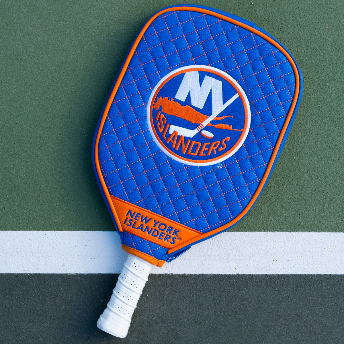 New York Islanders Blue quilted pickleball paddle cover on court