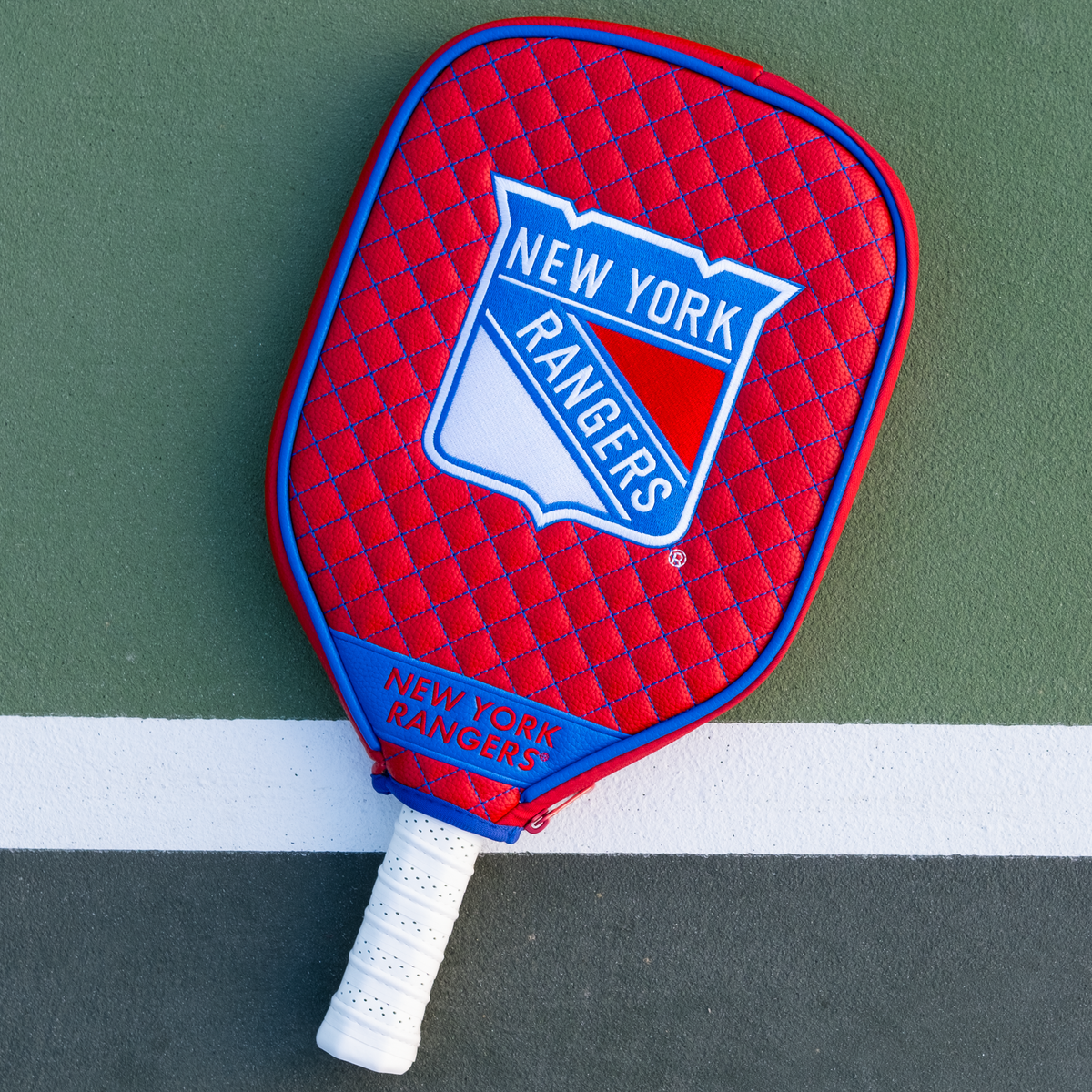 New York Rangers Red quilted pickleball paddle cover on court