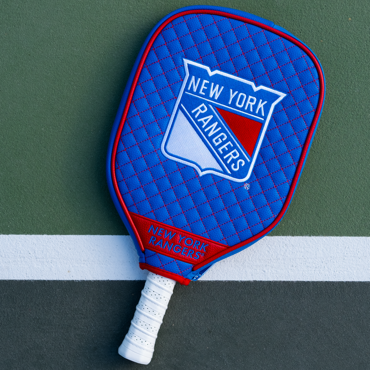 New York Rangers Blue quilted pickleball paddle cover on court