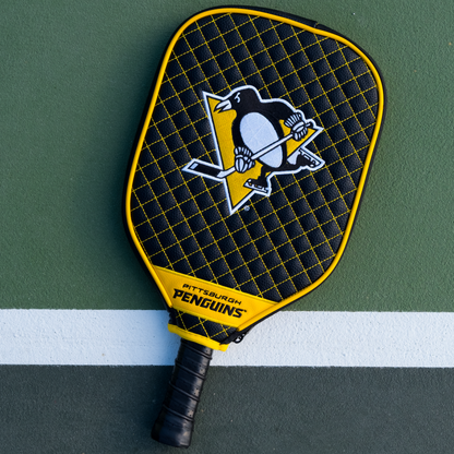 Pittsburgh Penguins quilted pickleball paddle cover on court view