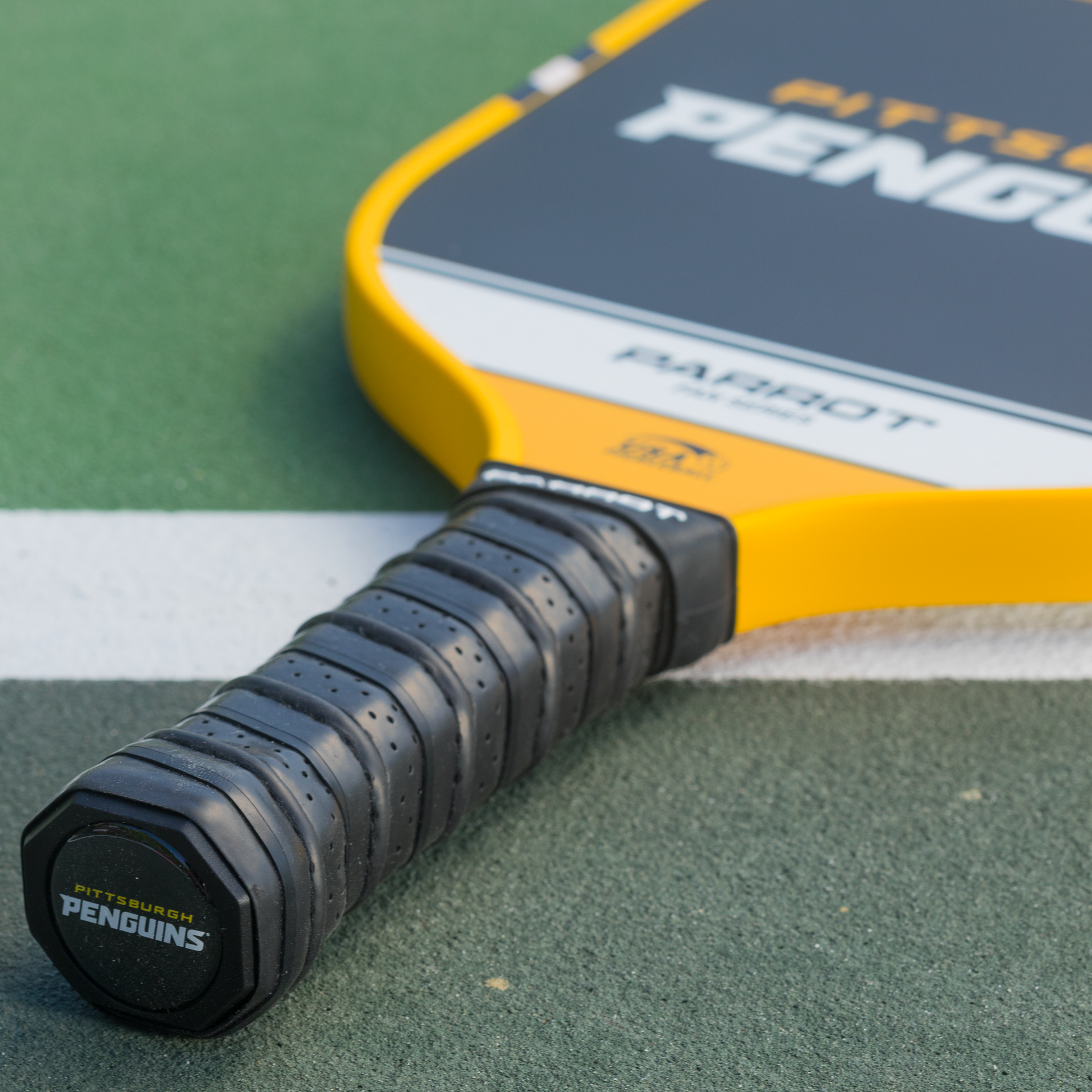 Pittsburgh Penguins Sport Plus pickleball paddle back view on the court