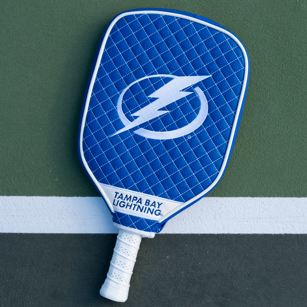 Tampa Bay Lightning quilted pickleball paddle cover on court view