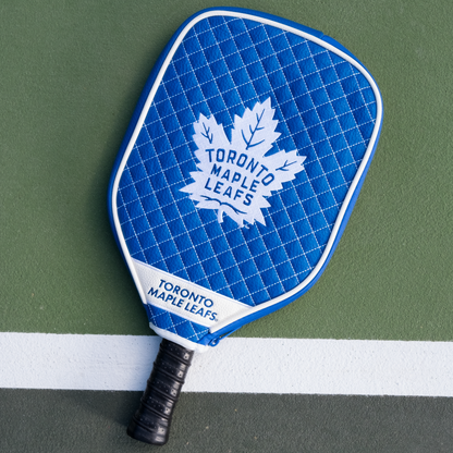 Toronto Maple Leafs quilted pickleball paddle cover on court view