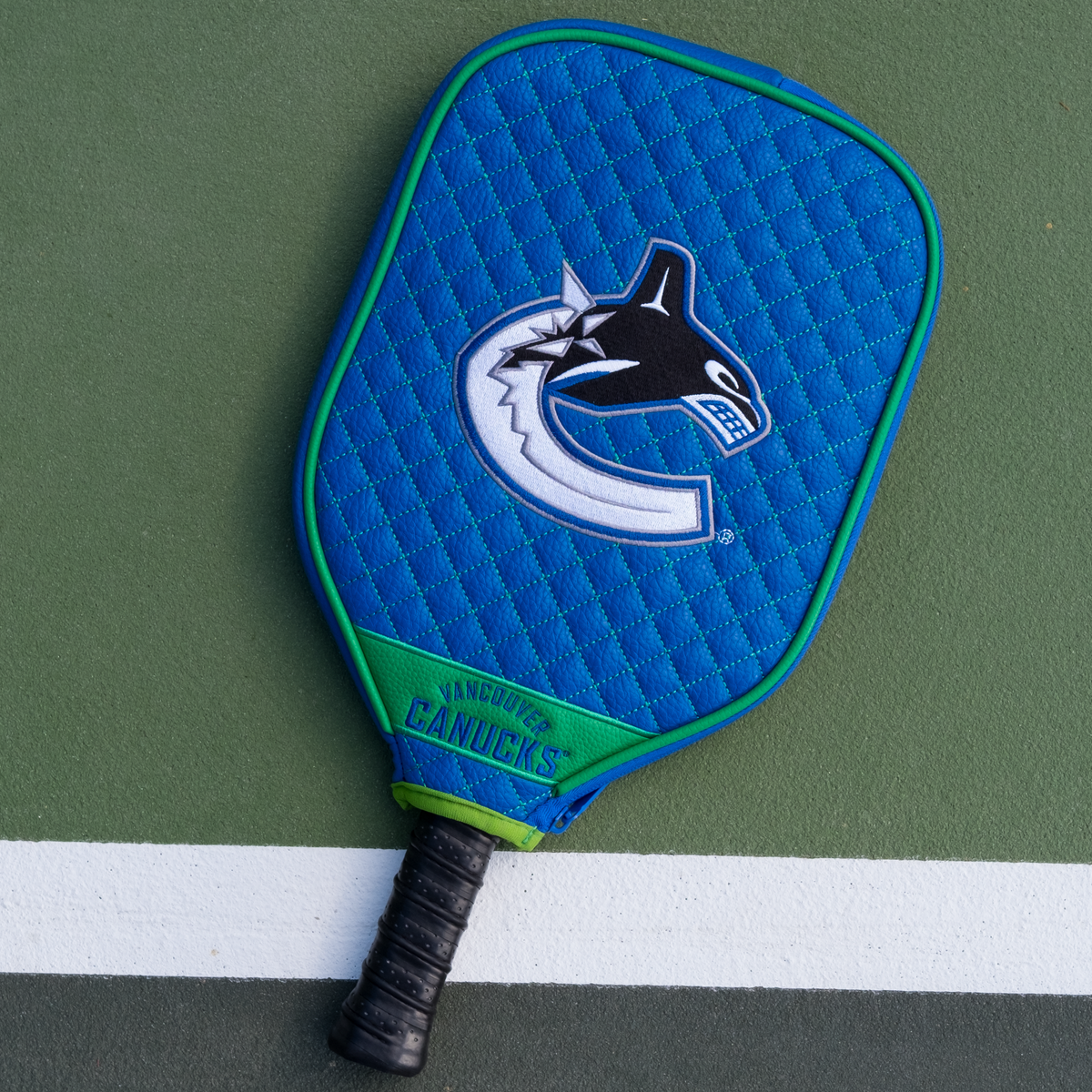 Vancouver Canucks quilted pickleball paddle cover on court view