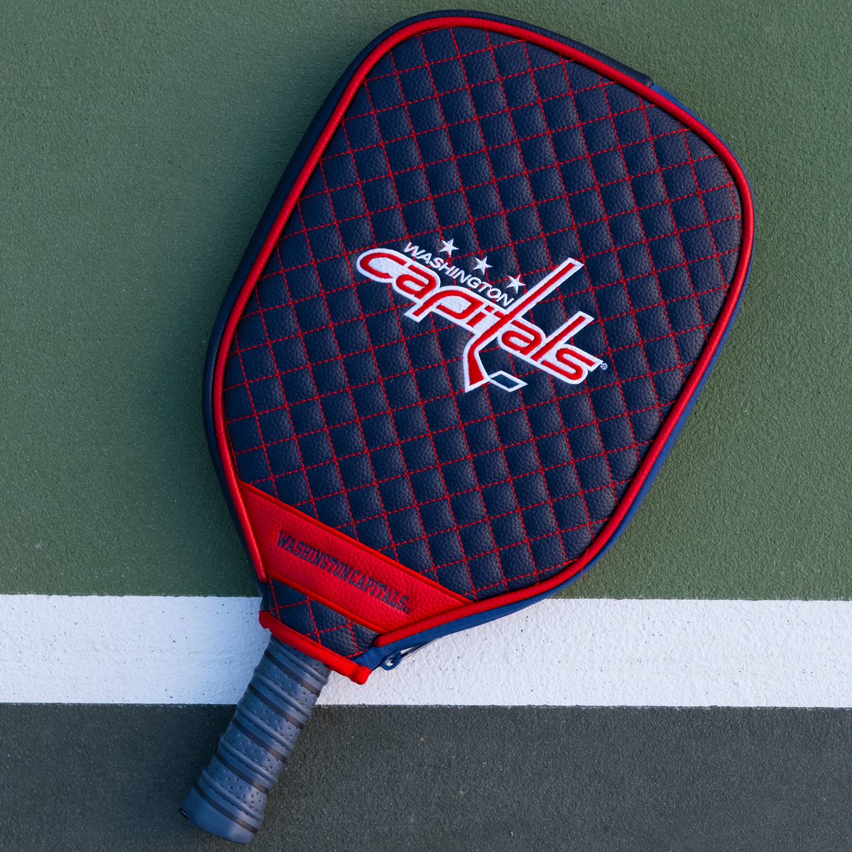 Washington Capitals Navy quilted pickleball paddle cover on court