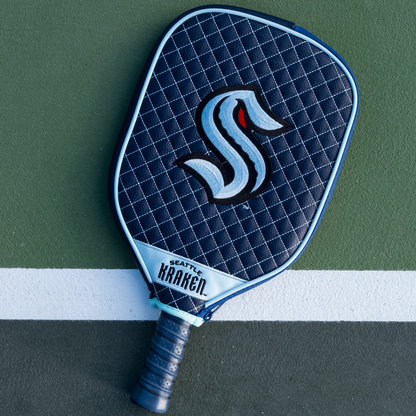 Seattle Kraken quilted pickleball paddle cover on court view