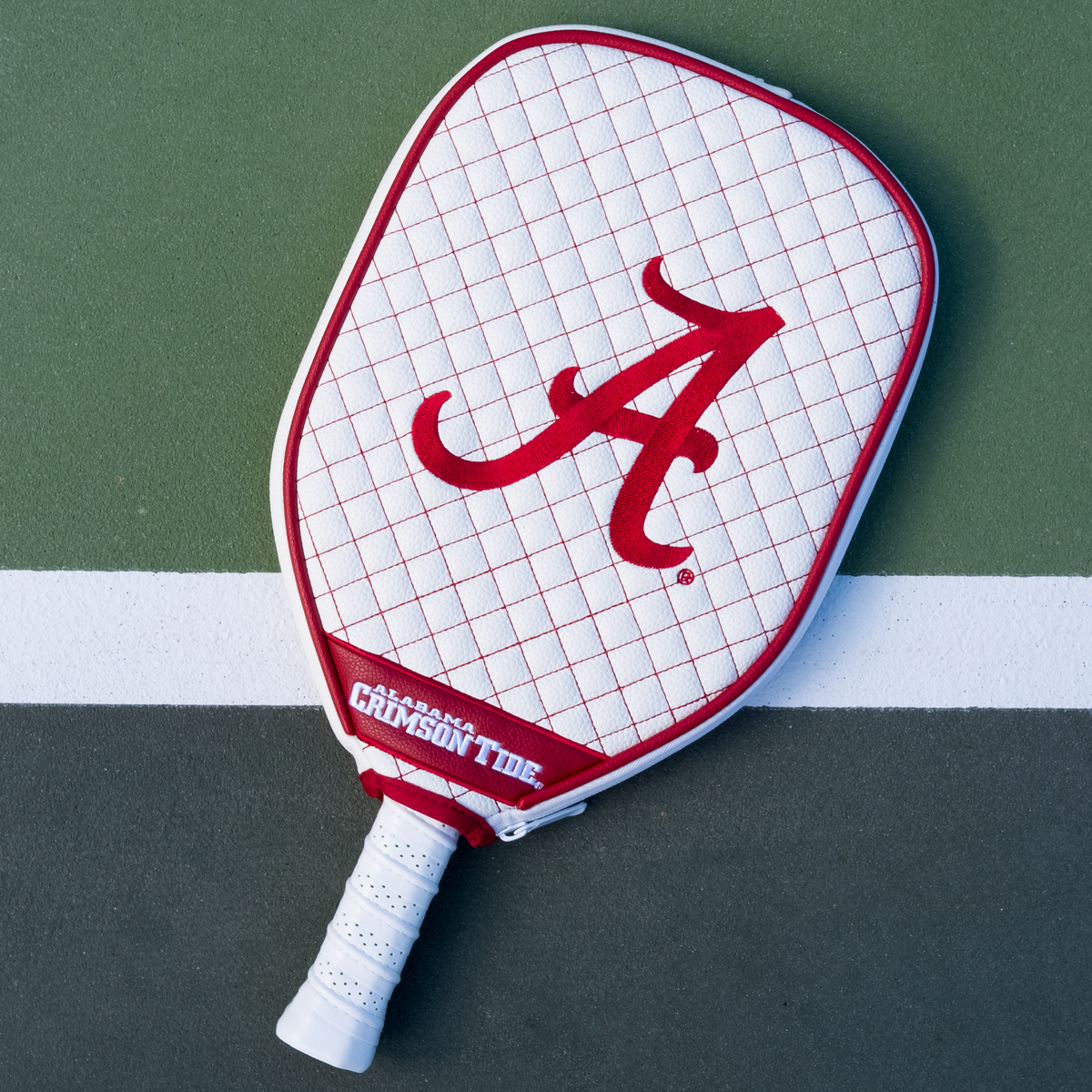 Alabama Crimson Tide White quilted pickleball paddle cover on court