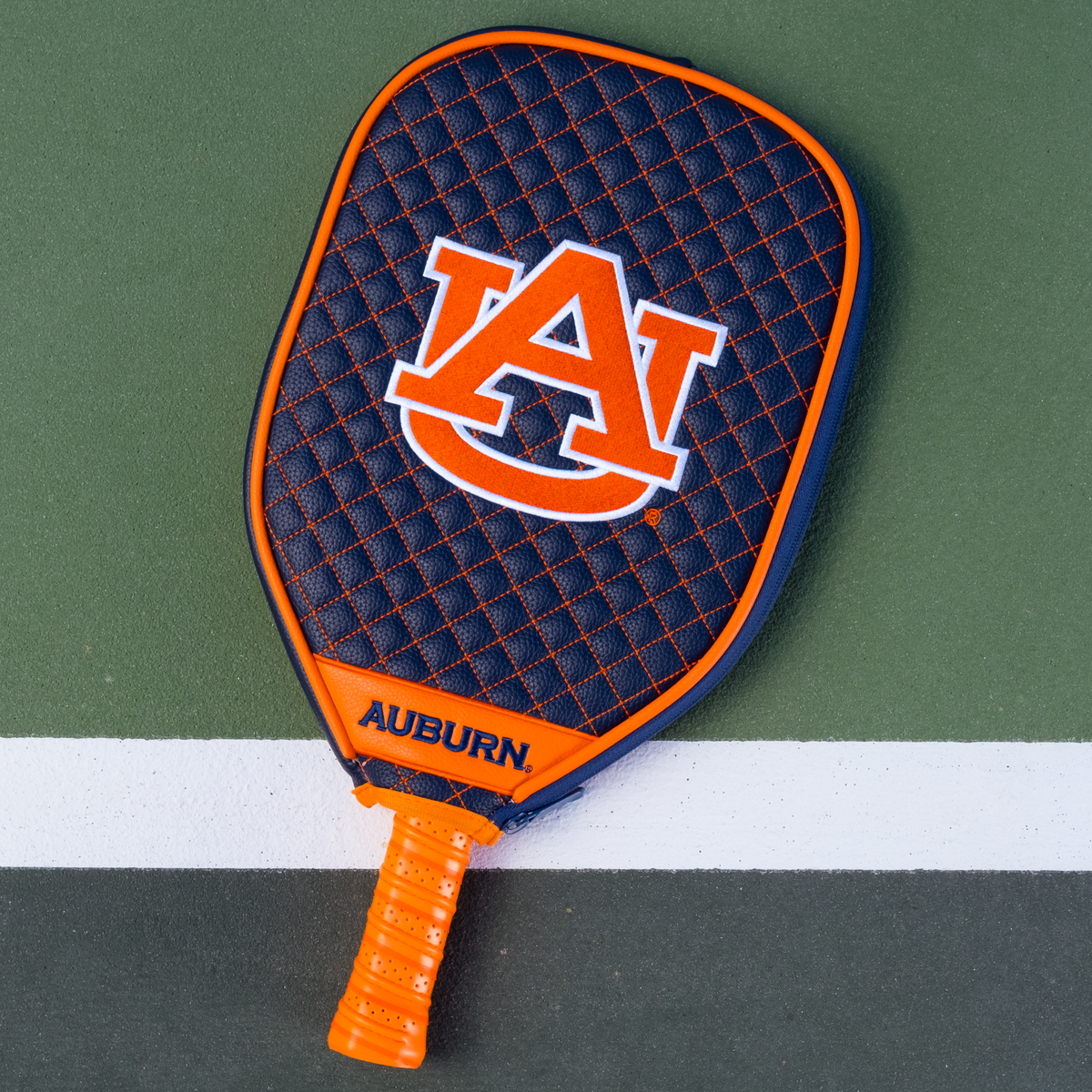 Auburn Tigers Navy quilted pickleball paddle cover on court