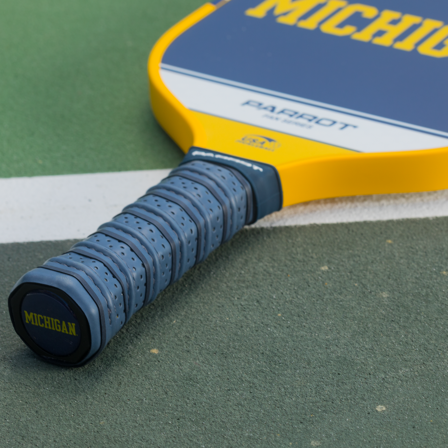 Michigan Wolverines Sport Plus pickleball paddle on the court