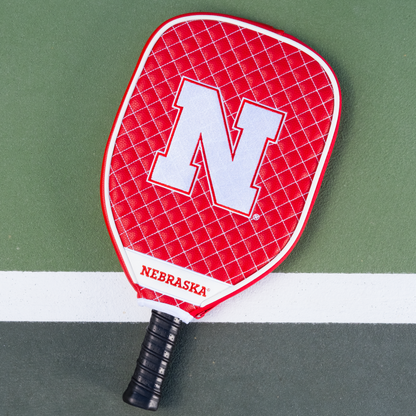 Nebraska Cornhuskers quilted pickleball paddle cover on court view