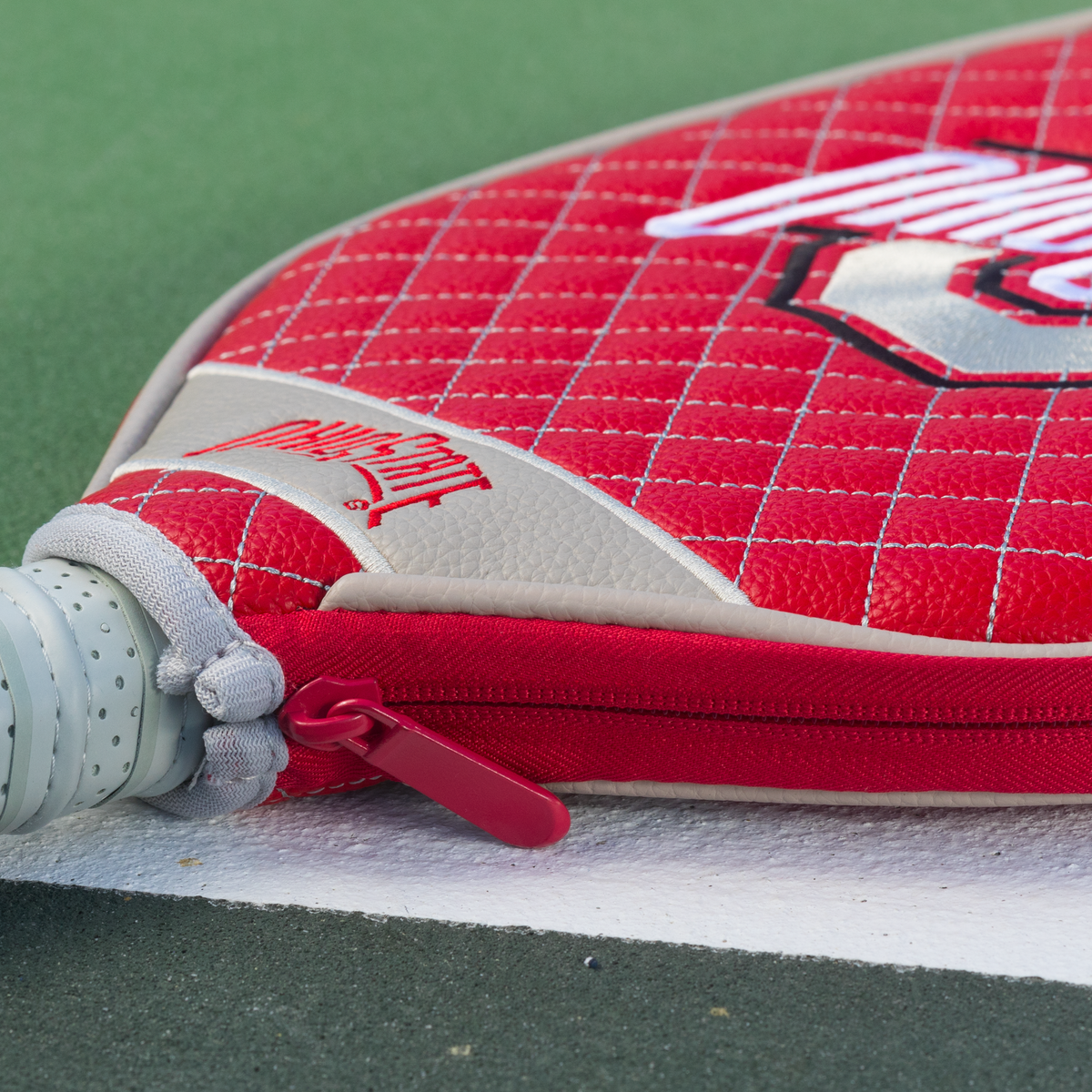 Ohio State Buckeyes Red quilted pickleball paddle cover closeup image