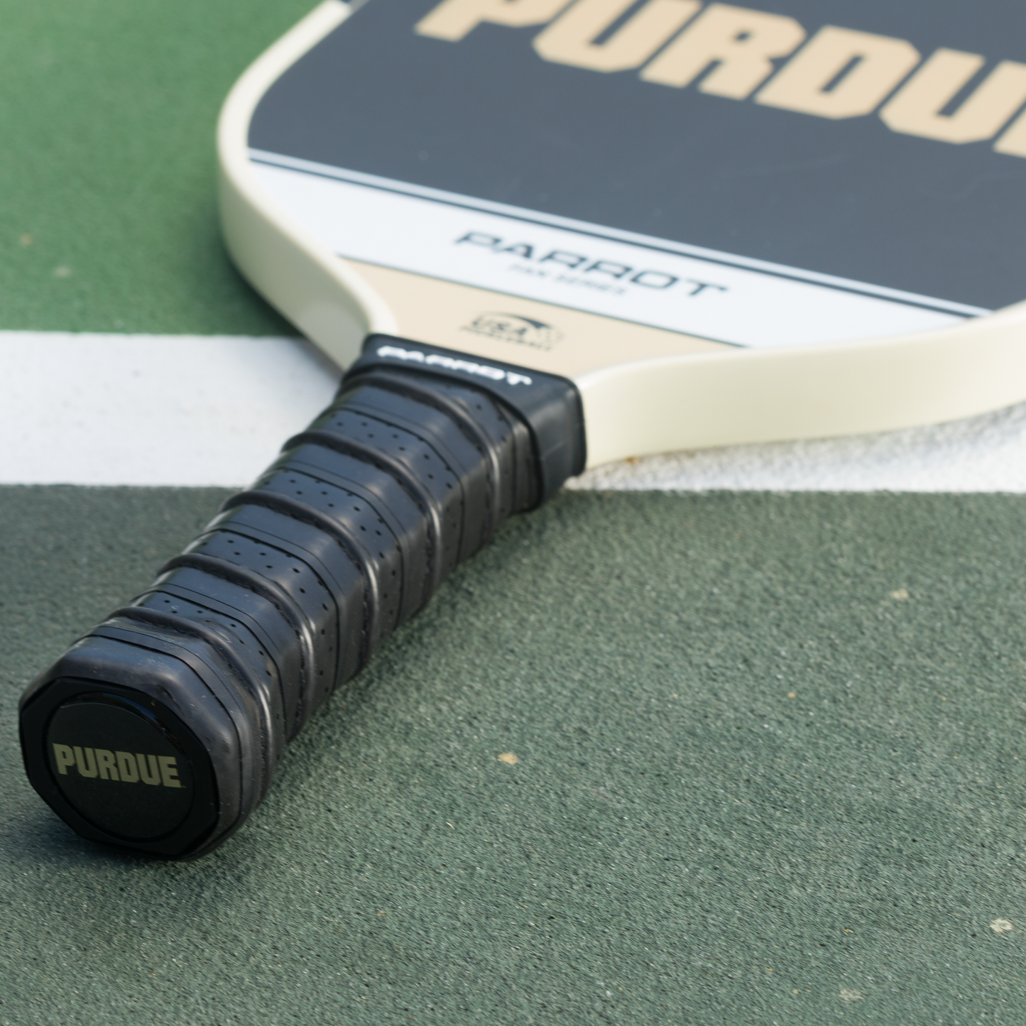 Purdue Boilermakers Sport Plus pickleball paddle on the court