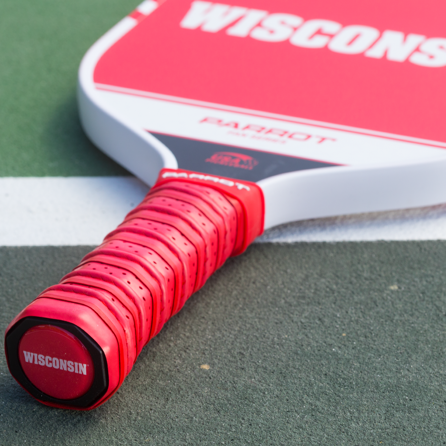 Wisconsin Badgers Sport Plus pickleball paddle on the court