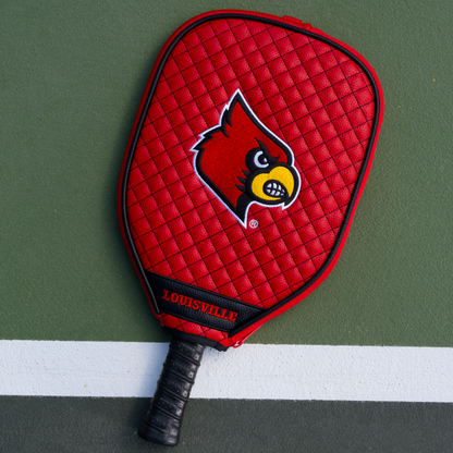 Louisville Cardinals quilted pickleball paddle cover on court view