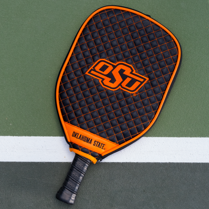 Oklahoma State Cowboys quilted pickleball paddle cover on court view