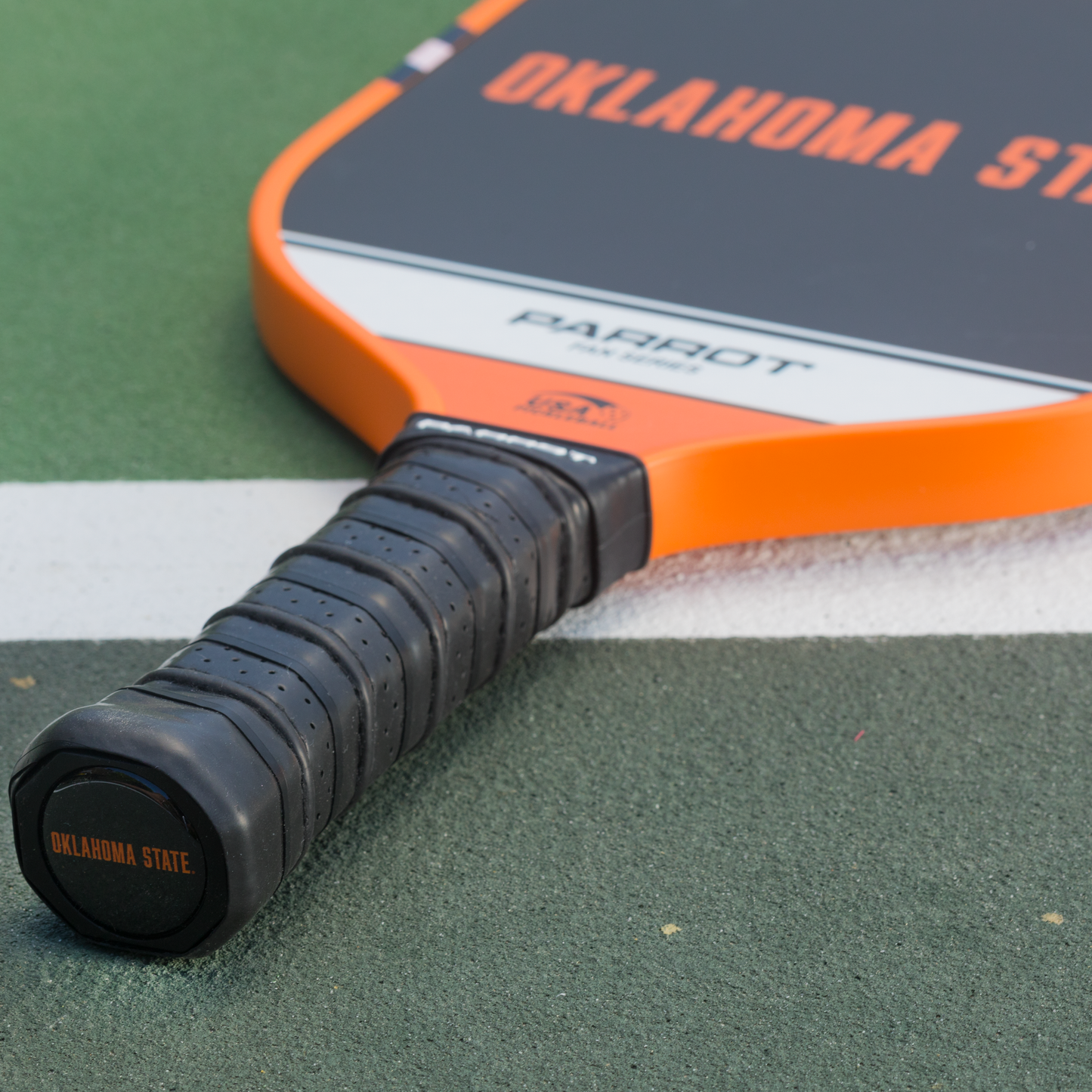 Oklahoma State Cowboys Sport Plus pickleball paddle on the court