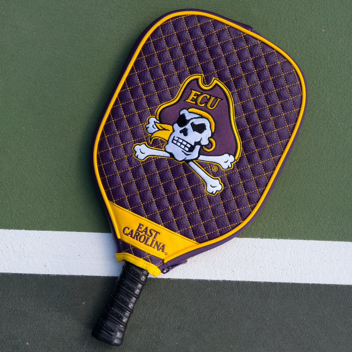 East Carolina Pirates quilted pickleball paddle cover on court view