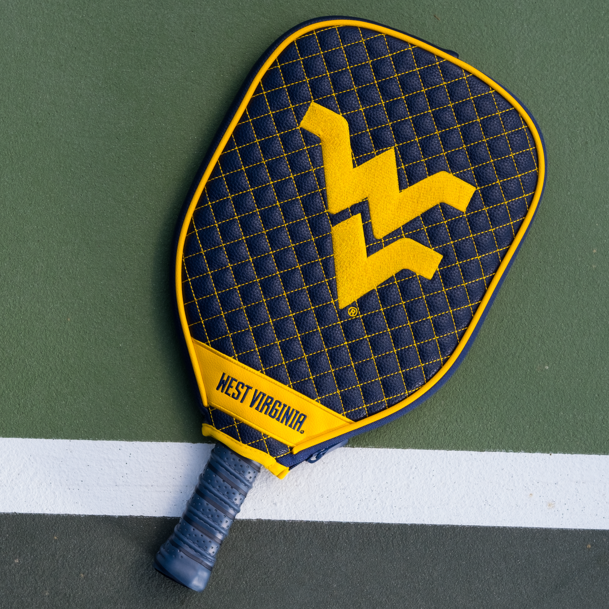 West Virginia Mountaineers quilted pickleball paddle cover on court view