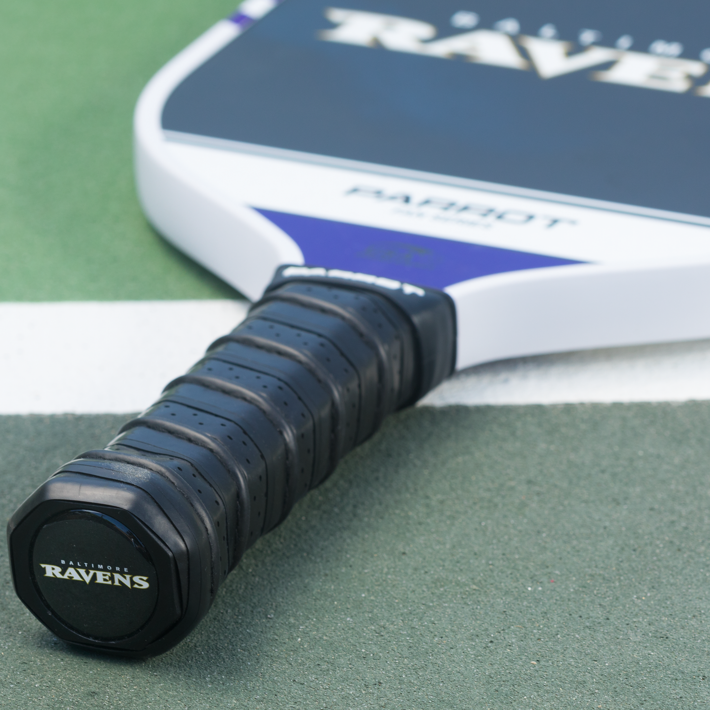Baltimore Ravens Sport Plus pickleball paddle on the court