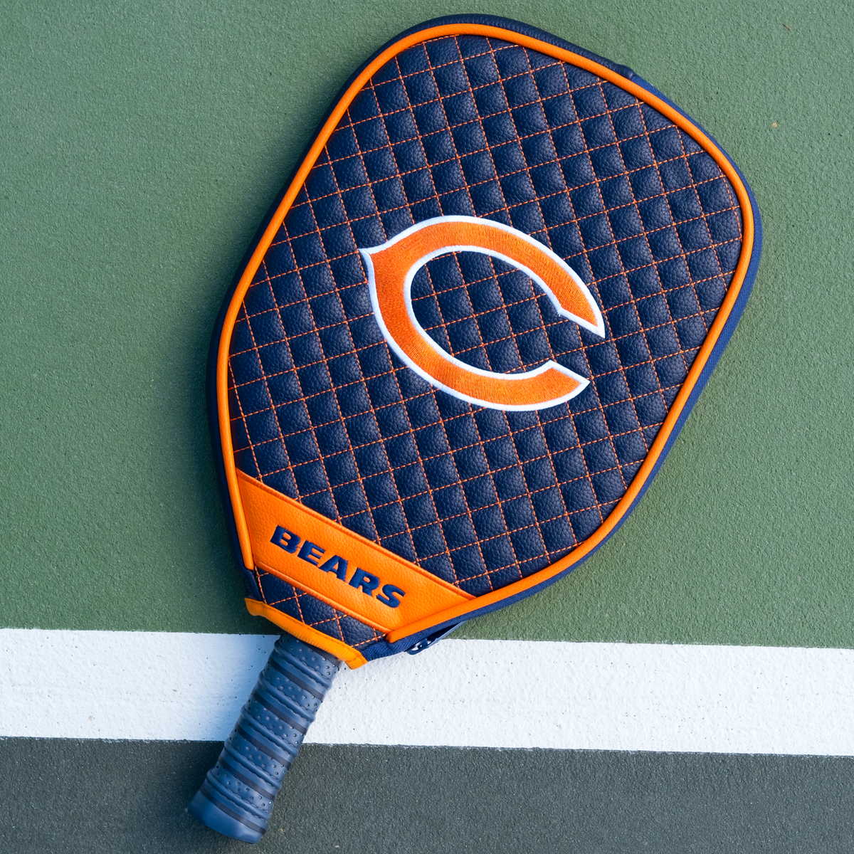 Chicago Bears Navy quilted pickleball paddle cover on court