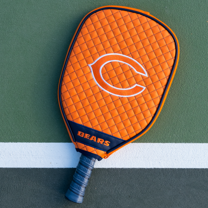 Chicago Bears Orange quilted pickleball paddle cover on court
