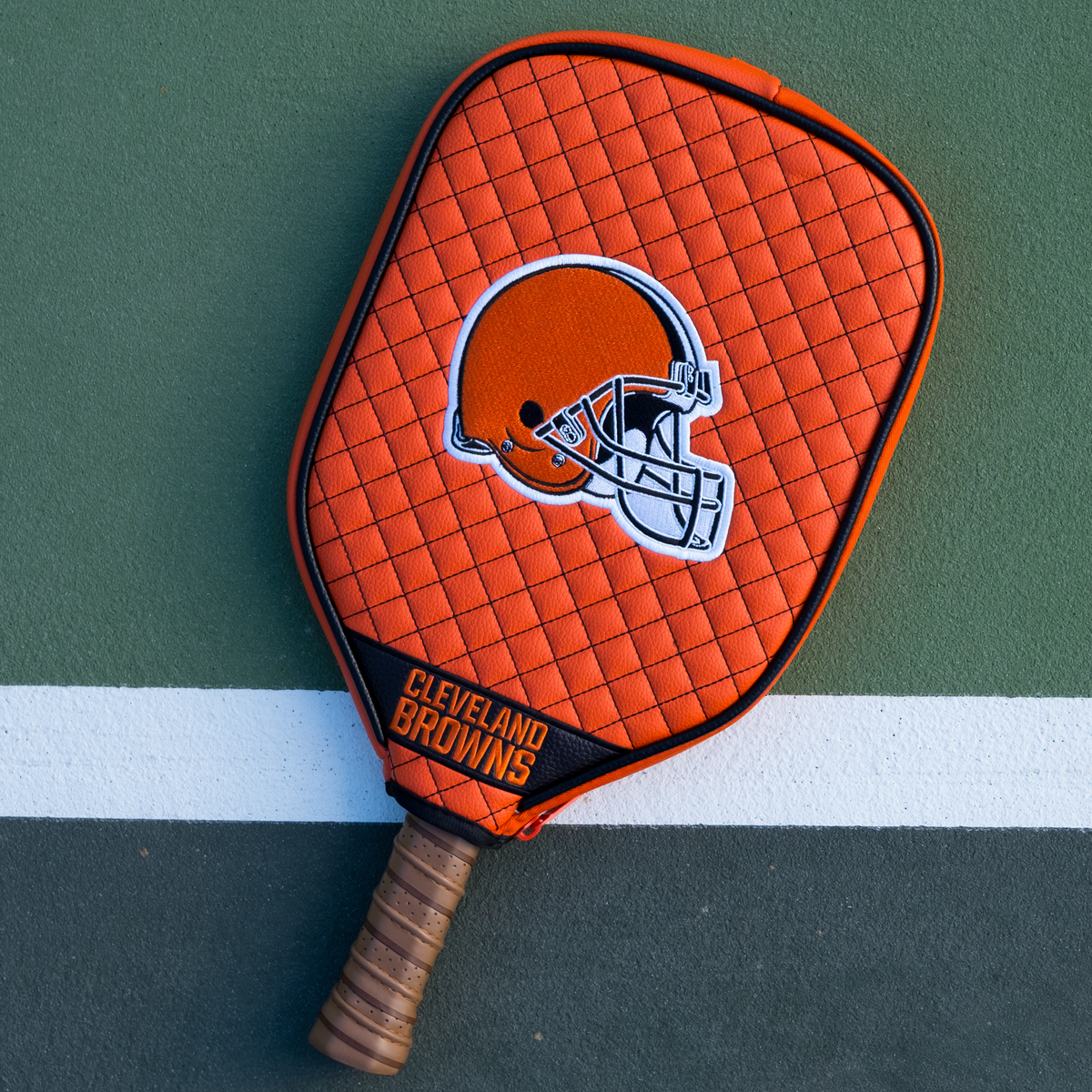 Cleveland Browns quilted pickleball paddle cover on court view