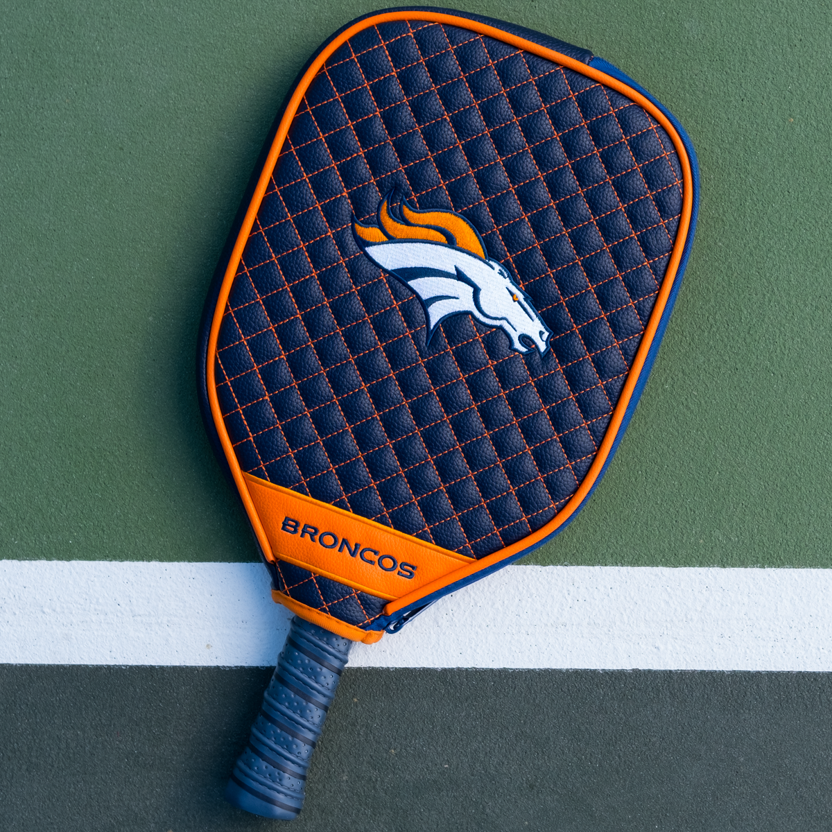 Denver Broncos Navy quilted pickleball paddle cover on court