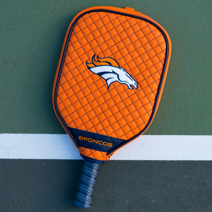Denver Broncos Orange quilted pickleball paddle cover on court