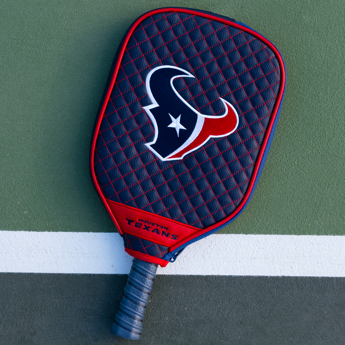 Houston Texans quilted pickleball paddle cover on court view