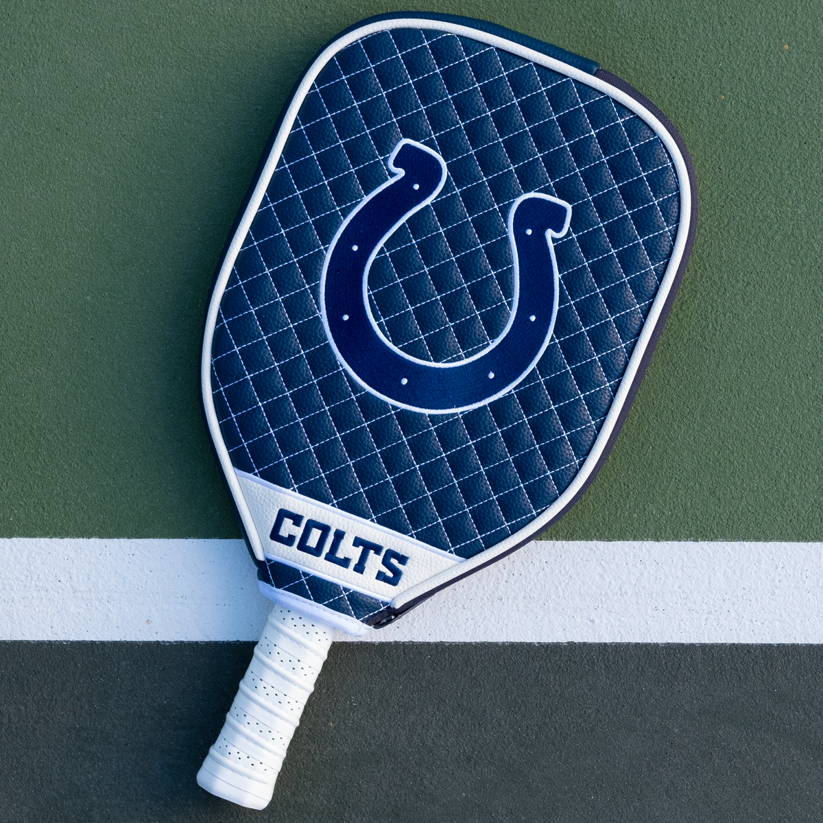 Indianapolis Colts quilted pickleball paddle cover on court view