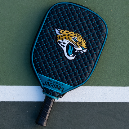 Jacksonville Jaguars quilted pickleball paddle cover on court view