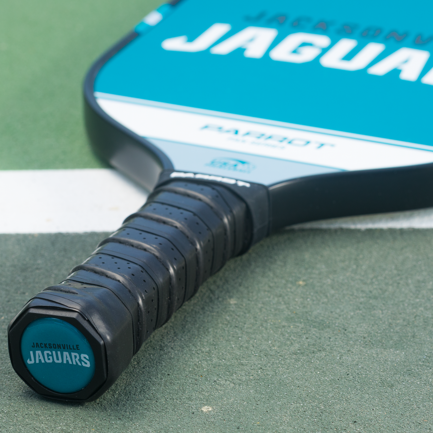 Jacksonville Jaguars Sport Plus pickleball paddle on the court