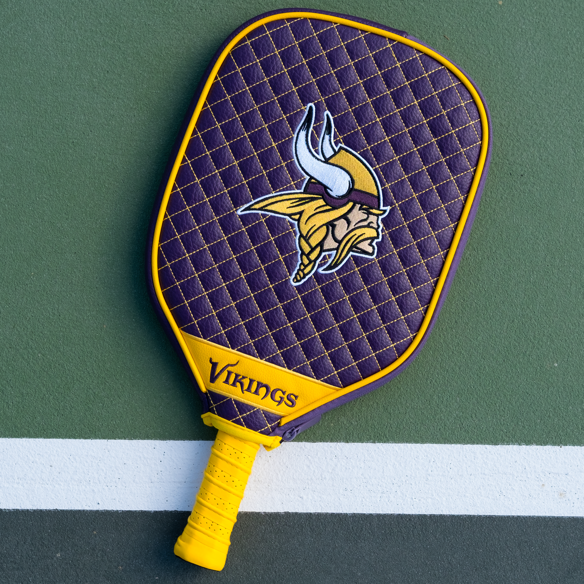 Minnesota Vikings quilted pickleball paddle cover on court view
